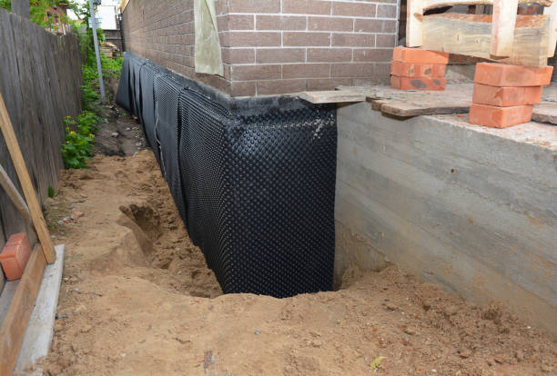 Happy homeowners after waterproofing job in Cosby